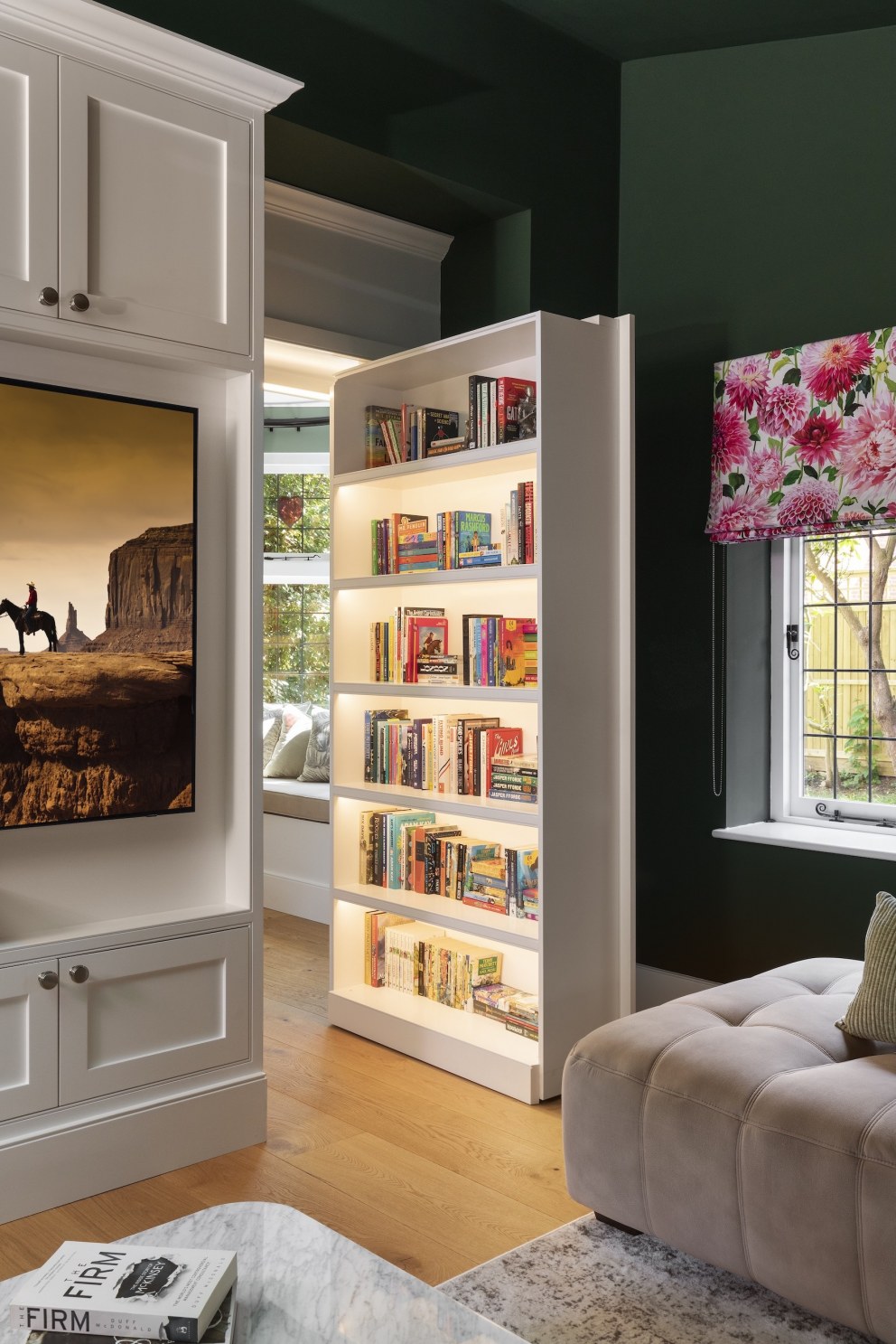 Epping Forest family home | View of library secret door from cinema room | Interior Designers